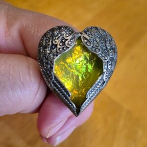 Green and Silver Heart-Shaped Ring with Ornate Design